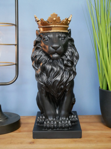 Black sitting lion with - sitting,